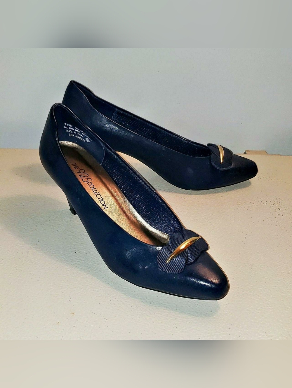 The 925 Collection Navy Pointed-Toe Flats with Gold Accent
